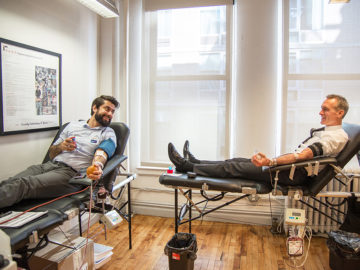 Power Red donor Eugene Gurevich, PE and whole blood donor, RAND's Business Development Director Peter Scallion chat while donating.