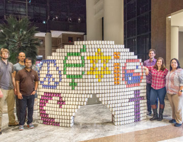 RAND Engineering & Architecture's 2017 Canstruction NY team and sculpture "We CAN Co-Exist"