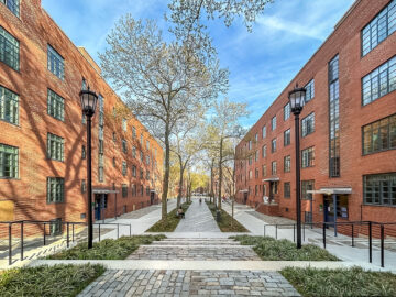 View of restored historic buildings at Harlem River Houses, a 1930s New Deal-era public housing development in Harlem, New York City. Restoration by RAND Engineering & Architecture, DPC and project team honored with a 2025 Lucy G. Moses Preservation Award.