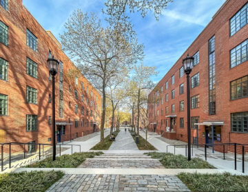 View of restored historic buildings at Harlem River Houses, a 1930s New Deal-era public housing development in Harlem, New York City. Restoration by RAND Engineering & Architecture, DPC and project team honored with a 2025 Lucy G. Moses Preservation Award.