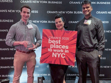 RAND Office Manager Jenny Derici and Client Services Associates Jackson Berns and Mark Bramlall accept the award on behalf of RAND at Crain's Best Places to Work in NYC award ceremony.
