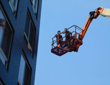 Facade Inspection Safety Program (FISP) hand-on inspection by boom lift