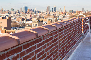 Hands-on Facade Inspection Safety Program (FISP) inspection by motorized scaffold in New York City.