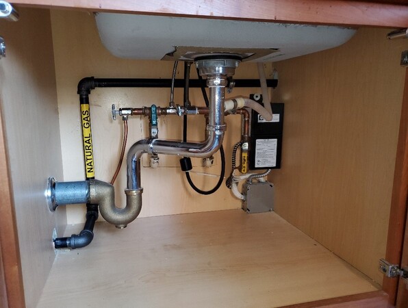 Kitchen gas branch piping underneath sink